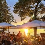 Dîner en terrasse au coucher du soleil avec vue panoramique sur le lac Léman au restaurant Le Redon