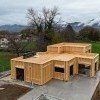 Structure de maison ossature bois en cours de montage, construction mise en œuvre par LBG Charpente