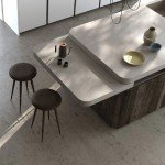 Détail d'un îlot de cuisine haut de gamme avec table coulissante par Aran Cucine Store à Montpellier 34